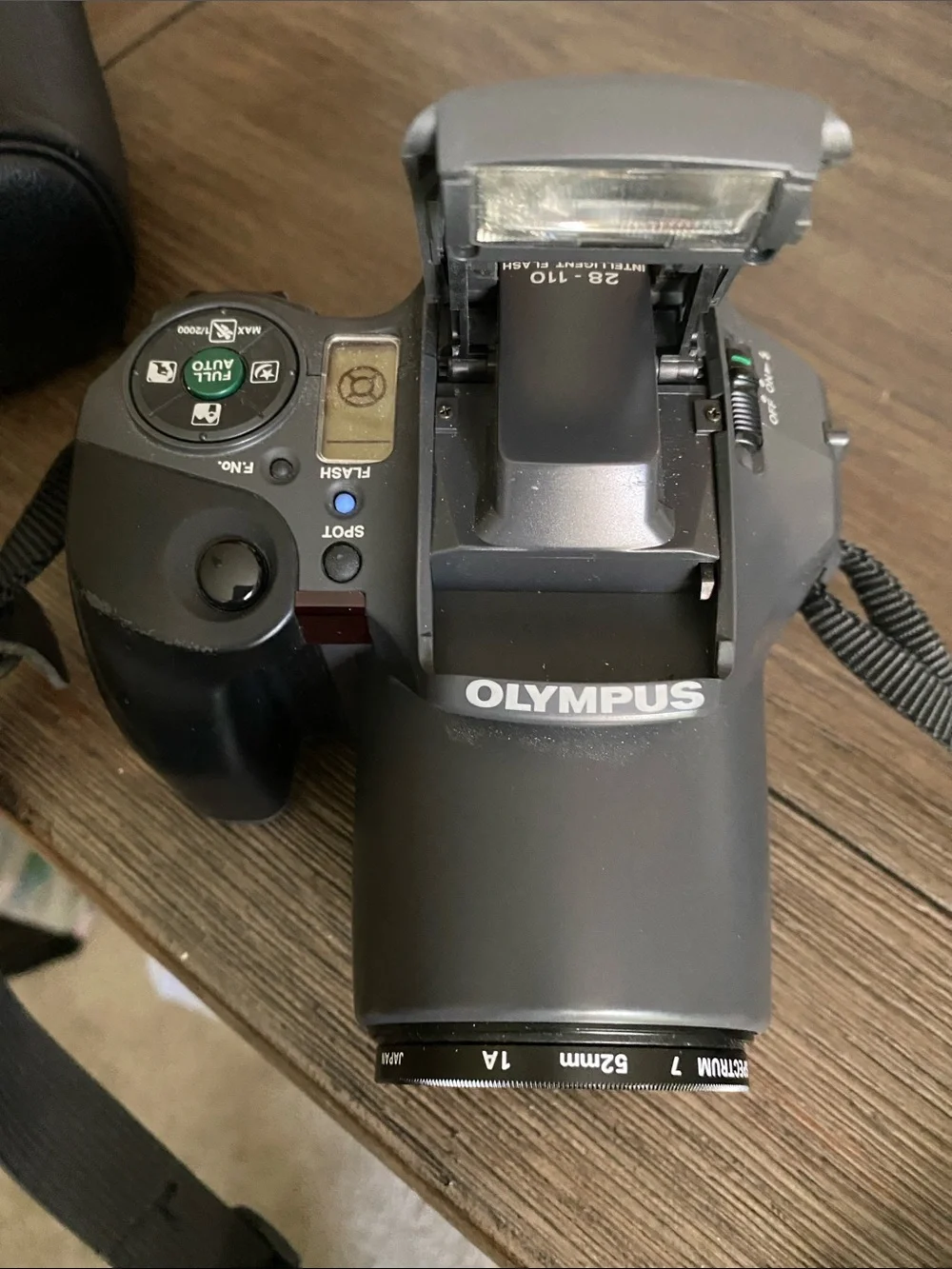 Olympus Digital Camera IS10 with Built-In Flash and Strap